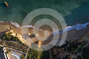 Aerial drone photo of the beautiful Alemao Beach Praia do Alemao with the sea and cliffs, in Portimao