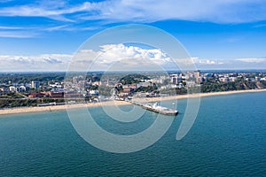 Aerial drone photo of the Bournemouth beach, Observation Wheel and Pier on a beautiful sunny summers day with lots of people