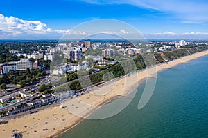 Aerial drone photo of the Bournemouth beach and town centre on a beautiful sunny summers day showing people on the sandy beach on