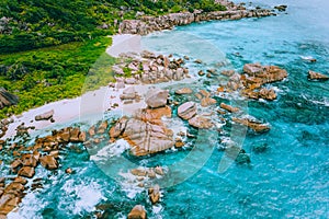 Aerial drone photo of group of rocks on tropical hidden secret beach Marron at La Digue island, Seychelles. White sand