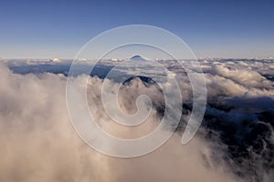Aerial drone photo - Mt. Fuji rising above the clouds