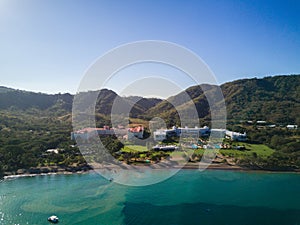 Aerial Drone Photo - Resort hotels along the Pacific coast of Costa Rica, surrounded by rugged mountains