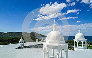 Aerial Drone Photo - Resort hotels along the Pacific coast of Costa Rica, surrounded by rugged mountains