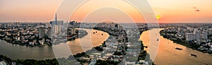 Aerial drone photo - Skyline of Saigon Ho Chi Minh City at sunset. Vietnam