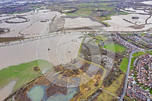 Aerial drone photo of the town of Allerton Bywater near Castleford in Leeds West Yorkshire showing the flooded fields and farm
