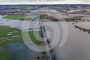 Aerial drone photo of the town of Allerton Bywater near Castleford in Leeds West Yorkshire showing the flooded from theand farm photo