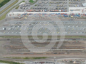 Aerial drone photo of train and truck intermodal transport site. Railway tracks and trucks. photo