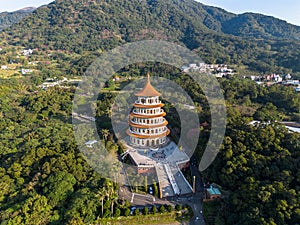 Aerial drone photo of Wuji Tianyuan Temple in Tamsui, New Taipei City, Taiwan with beautiful blue sky