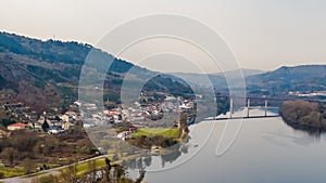 Aerial drone photography over the Mino river in the town of Barbantes in the province of Orense, in Galicia, Spain