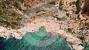 Aerial drone point directly from above view rocky coastline and turquoise Mediterranean Sea