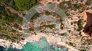 Aerial drone point directly from above view rocky coastline and turquoise Mediterranean Sea