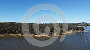 The aerial drone point of view footage at Bowna Waters Reserve is natural parkland on the foreshore of Lake Hume
