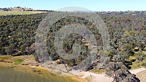 The aerial drone point of view footage high angle to low angle at Bowna Waters Reserve is natural parkland on the foreshore.