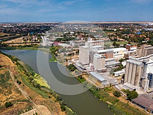 Aerial drone pov view of industrial cityscape with factory build