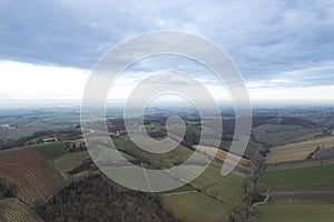 aerial drone scenic of hills, vineyards and farms in Martani near Castell'Arquato in Arda Valley, Italy.