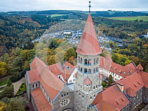 Aerial drone Shot of Abbey in Clervaux, Luxembourg in mystery evening twilight