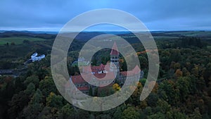 Aerial drone shot of Abbey in Clervaux, Luxembourg in mystery evening twilight