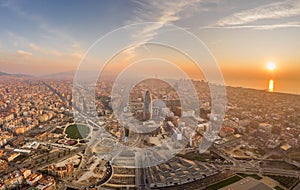 Aerial drone shot of agbar tower by Barcelona beach with sunrise