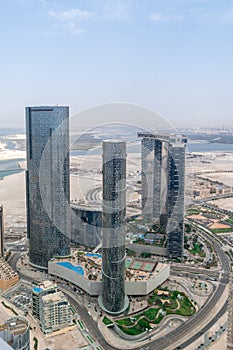 Aerial drone shot of Al Reem island Sun, Sky towers and Gate tower landmarks in Abu Dhabi city, UAE
