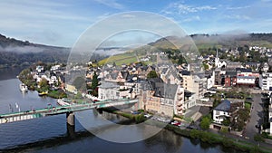 Aerial Drone Shot in autumn of Traben-Trarbach with Morning Fog. River Moselle in early fall, Germany. Moselland.