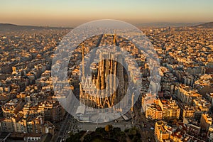 Aerial drone shot of Barcelona city center in Sunrise golden hour during Spain winter