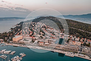 Aerial drone shot of buildings on Marjan hill in Split during sunrise hour in Croatia