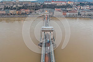Aerial drone shot of Chain bridge before sunrise at dawn w Royal Palace on buda hill