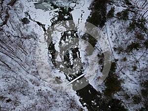 Aerial drone shot of Chittenango Waterfall in the winter.