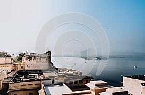 Aerial drone shot of the cityscape of Udaipur with the City Palace, Mewar, India