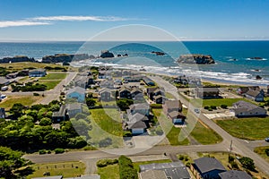 Aerial drone shot of coastal homes on bluff in Bandon, Oregon.