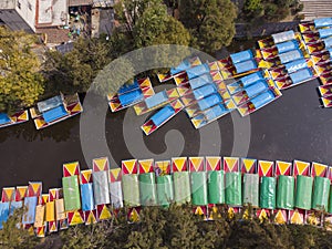 Aerial Drone Shot of Colorful Boats in Xochimilco. Tours by cannels with floating gardens in Mexico City CDMX, Mexico photo