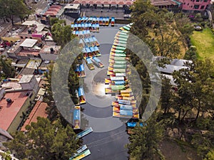 Aerial Drone Shot of Colorful Boats in Xochimilco. Tours by cannels with floating gardens in Mexico City CDMX, Mexico photo
