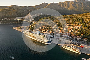 Aerial drone shot of cruise ship at Port Gruz in dalmatia coastline in Croatia summer sunset