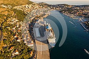 Aerial drone shot of cruise ship at Port Gruz in dalmatia coastline in Croatia summer sunset