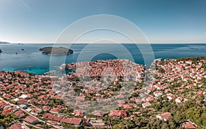 Aerial drone shot of Dubrovink city old town with view of Lokrum island in Croatia summer morning