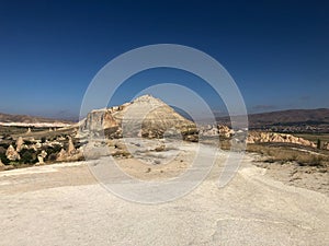 Aerial drone shot of the Fairy Chimneys over the landscape of Goreme, Cappadocia.