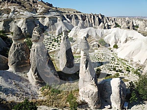 Aerial drone shot of the Fairy Chimneys over the landscape of Goreme, Cappadocia.