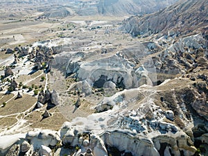 Aerial drone shot of the Fairy Chimneys over the landscape of Goreme, Cappadocia.