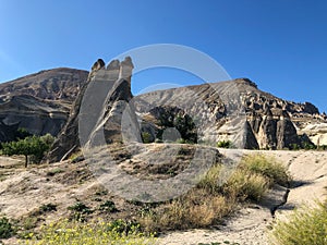 Aerial drone shot of the Fairy Chimneys over the landscape of Goreme, Cappadocia.