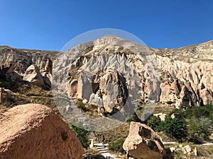 Aerial drone shot of the Fairy Chimneys over the landscape of Goreme, Cappadocia.