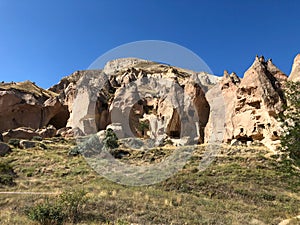 Aerial drone shot of the Fairy Chimneys over the landscape of Goreme, Cappadocia.