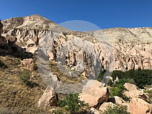 Aerial drone shot of the Fairy Chimneys over the landscape of Goreme, Cappadocia.