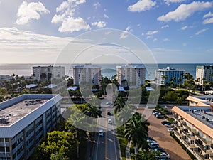 Aerial drone shot of the famous Miami beach buildings and streets with tropical palm trees, Florida