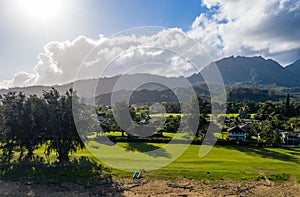 Aerial drone shot of Hanalei town and mountains from Waioli beach park