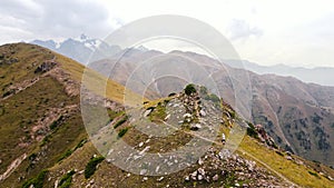 Aerial Drone shot of hiker at mountains in Kazakhstan