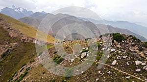 Aerial Drone shot of hiker at mountains in Kazakhstan