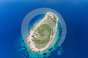 Aerial drone shot of Host Island in Adriatic sea near town port of Vis Island in Croatia summer