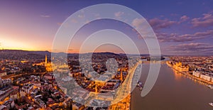 Aerial drone shot of lighted Matthias Churh Fisherman`s Bastion on Buda Hill in Budapest sunset time