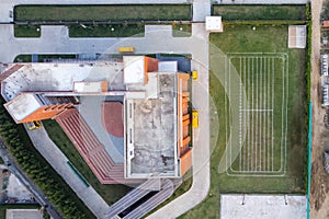 aerial drone shot looking straight down on school and it's playing feild with lines marked for sports in gurgaon photo