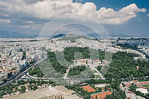 Aerial drone shot of Lycabettus hill and Zappeion in National Garden and Olimpio in Athens